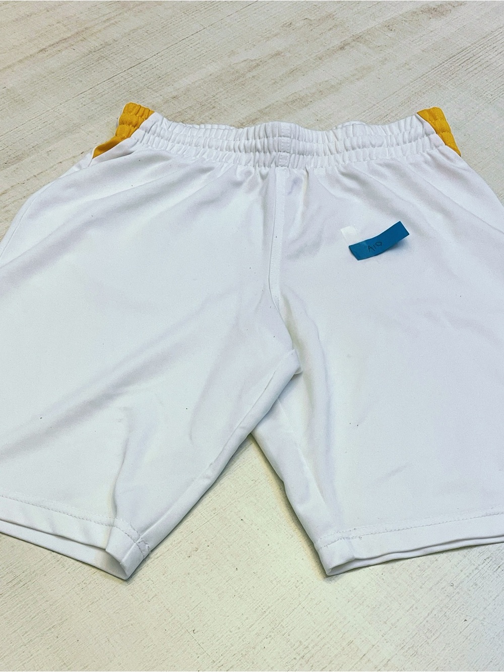 Umbro Men’s White Athletic Soccer Shorts with Gold Logos